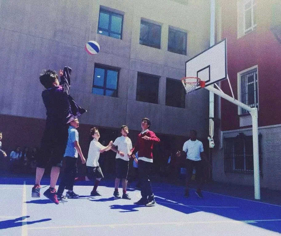 Wilson jumping for a shot during an outdoor basketball game
