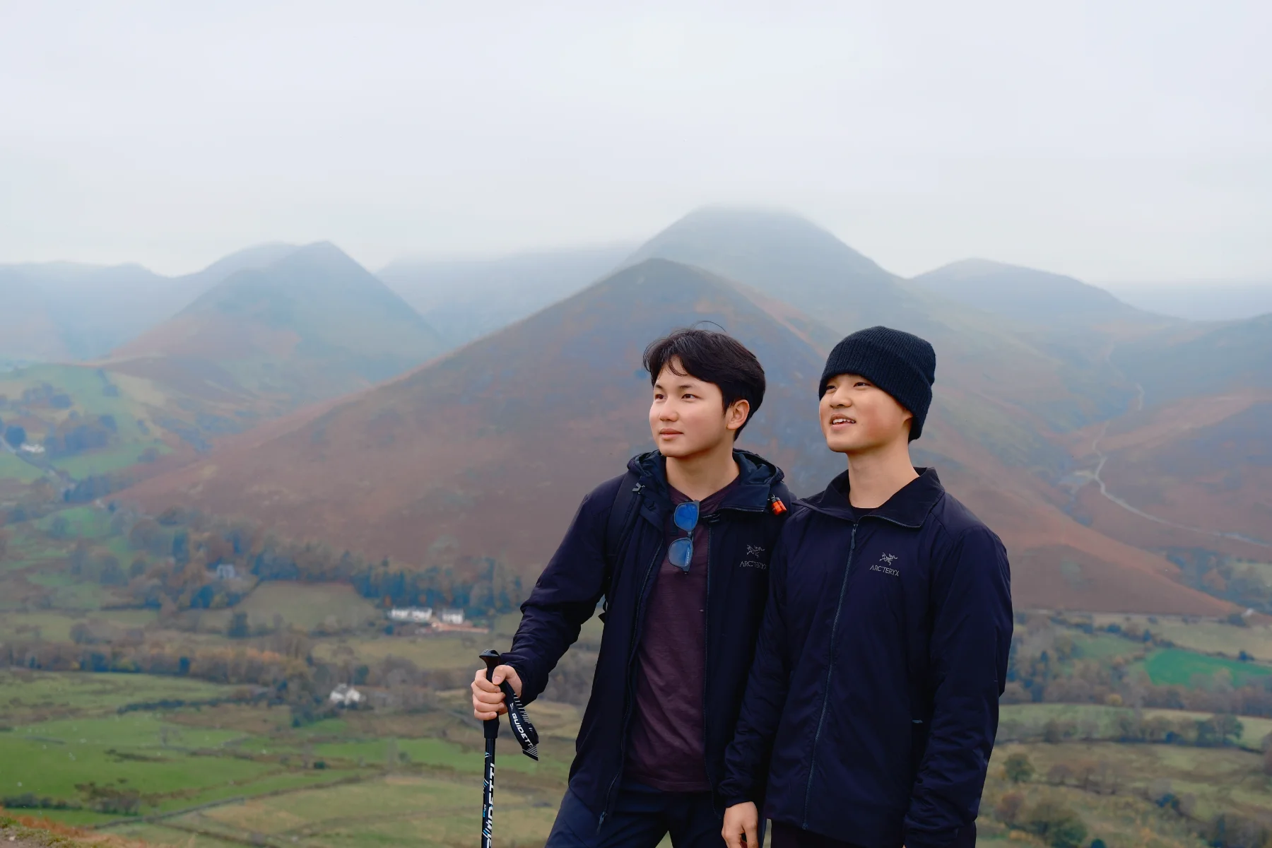 Wilson hiking with a friend in the misty Lake District fells